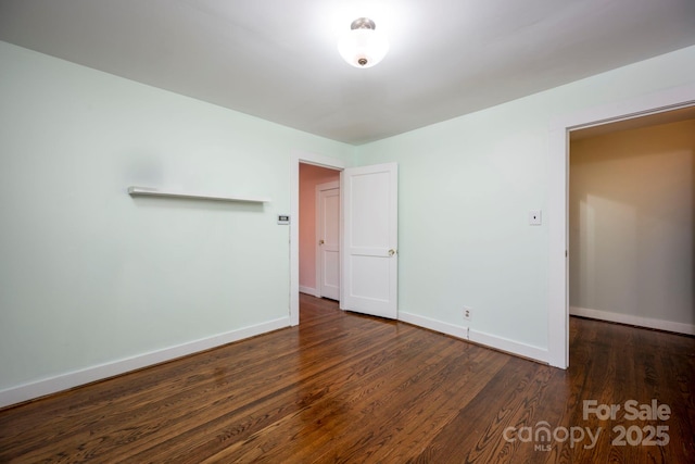 unfurnished bedroom featuring dark hardwood / wood-style floors