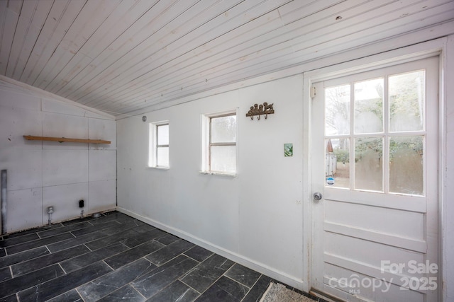 laundry area with plenty of natural light and wooden ceiling