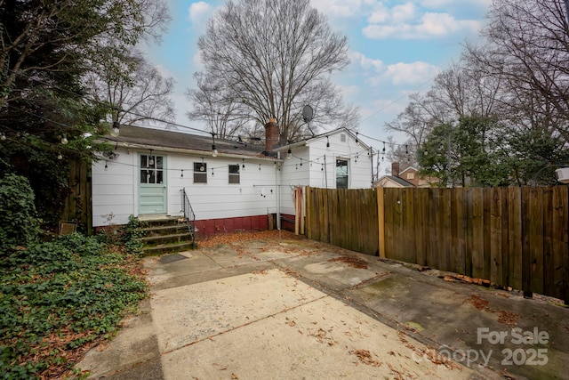 back of house with a patio