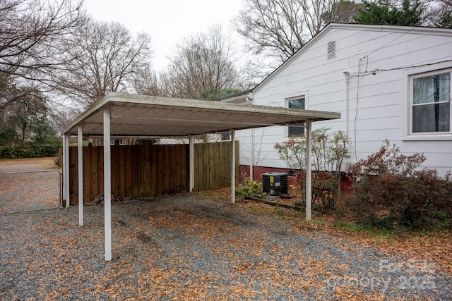 exterior space with a carport and central air condition unit