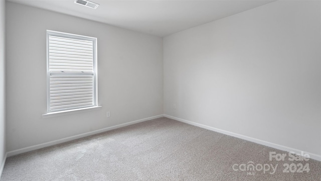 unfurnished room with carpet floors