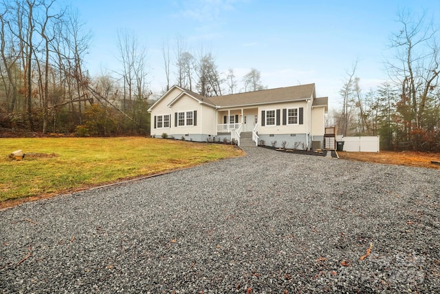 view of front facade with covered porch and a front yard