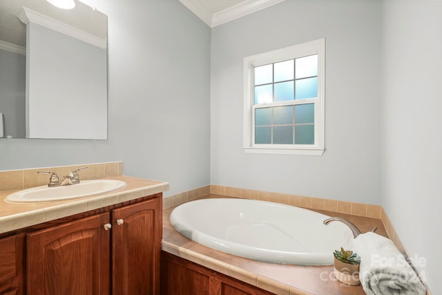 bathroom with a washtub, vanity, and crown molding