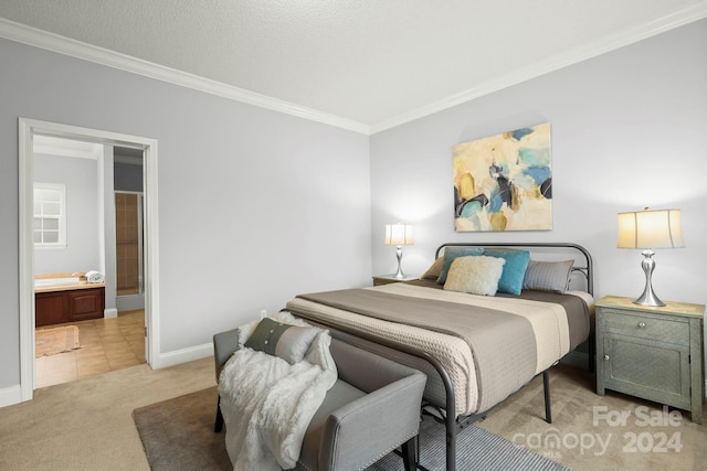 carpeted bedroom featuring a textured ceiling, ensuite bathroom, and ornamental molding