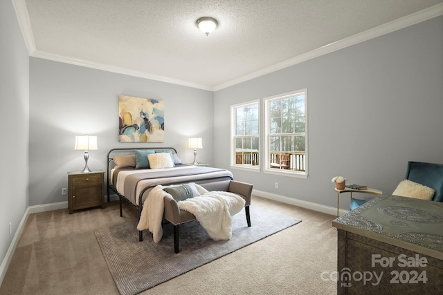 bedroom with carpet, a textured ceiling, and ornamental molding