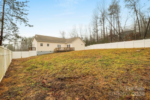 view of yard featuring a wooden deck