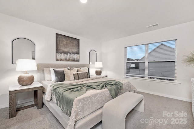 bedroom featuring light colored carpet