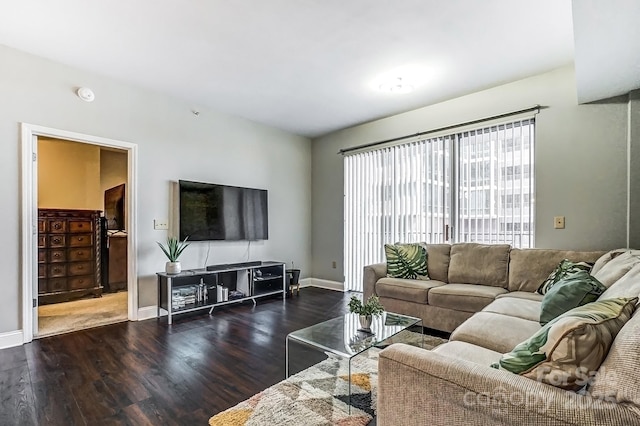 living area with wood finished floors and baseboards