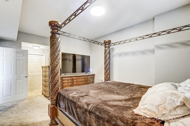 bedroom with light colored carpet