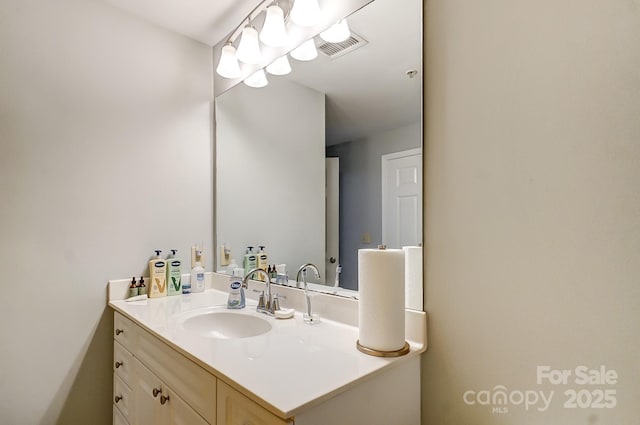 bathroom with visible vents and vanity