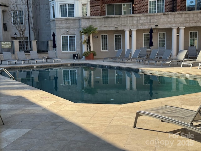 pool featuring a patio area