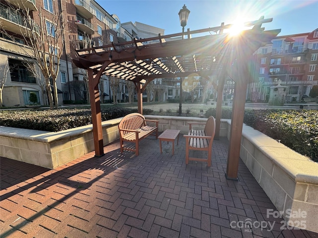 view of patio featuring a pergola