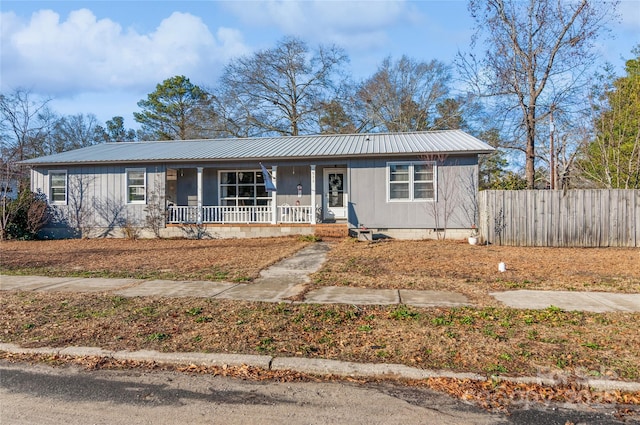 single story home featuring covered porch