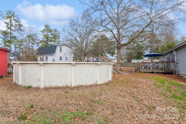 view of yard featuring a swimming pool side deck