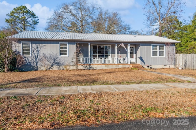 single story home featuring covered porch