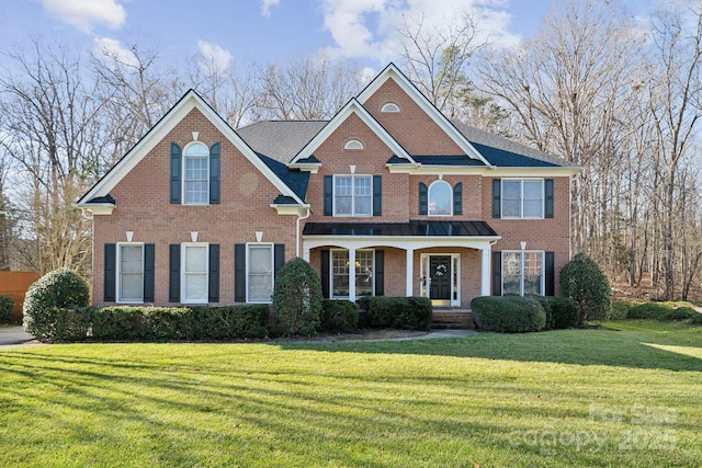 view of front facade featuring a front yard and a porch