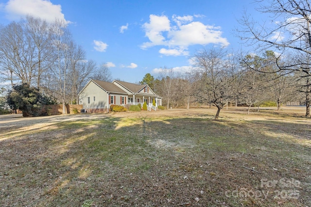 view of front of home with a front lawn and a porch