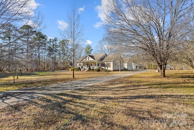 view of front of home with a front yard and a porch