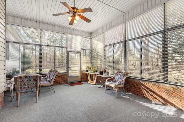 sunroom / solarium with a wealth of natural light and ceiling fan