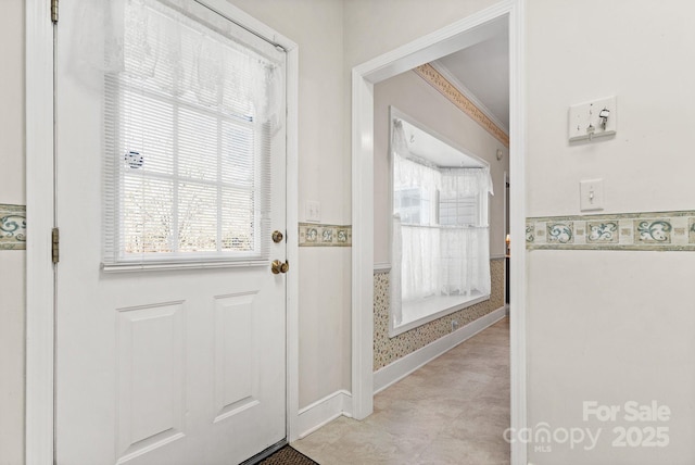 entryway with crown molding