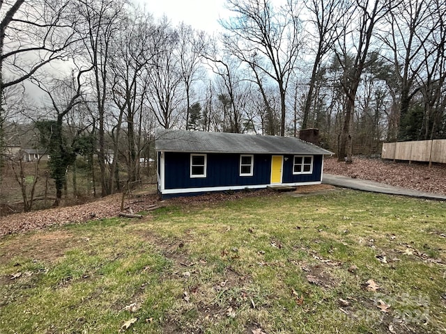 view of outbuilding with a lawn