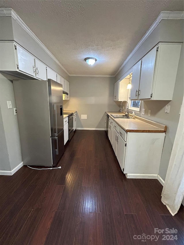 kitchen featuring white cabinets, sink, a textured ceiling, appliances with stainless steel finishes, and dark hardwood / wood-style flooring