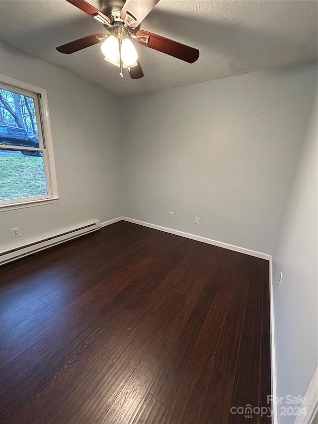 unfurnished room with wood-type flooring, a textured ceiling, baseboard heating, and ceiling fan