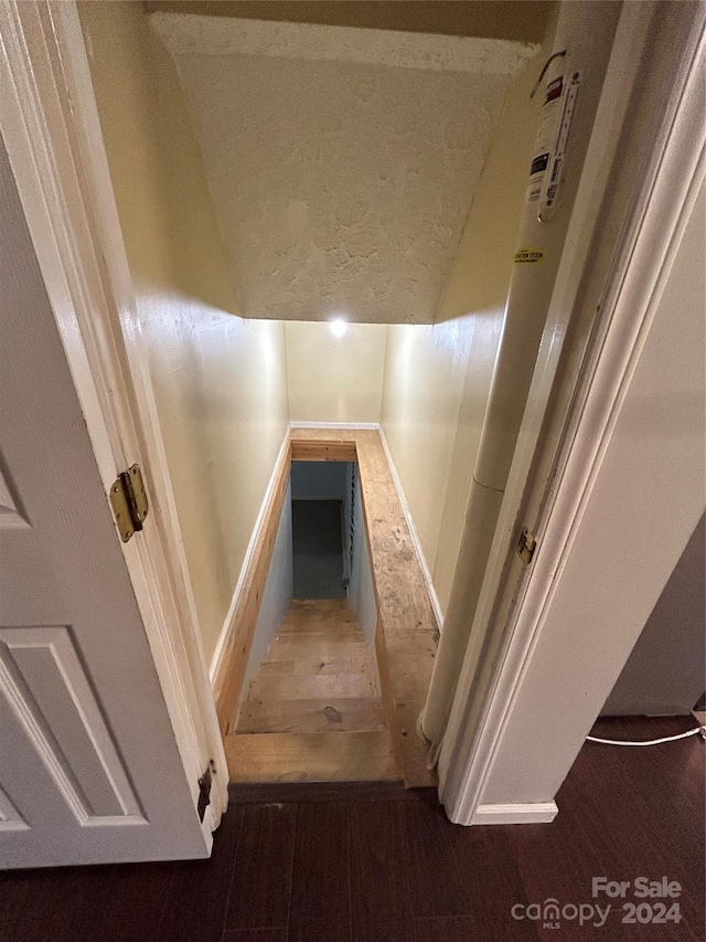 stairway featuring hardwood / wood-style flooring