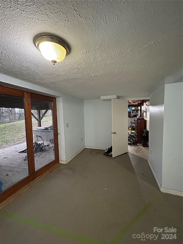 basement with a textured ceiling