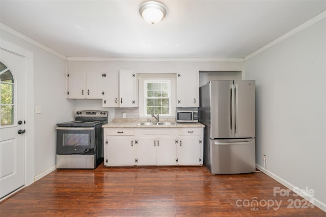 kitchen with dark wood-type flooring, sink, white cabinets, and stainless steel appliances