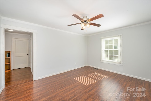 unfurnished room with crown molding, dark hardwood / wood-style flooring, and ceiling fan