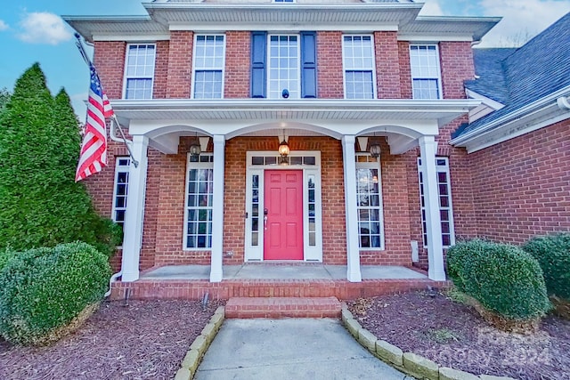 doorway to property with covered porch