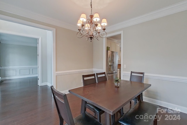 dining space featuring a chandelier, dark wood-type flooring, and crown molding