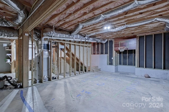 misc room featuring heating unit and concrete flooring