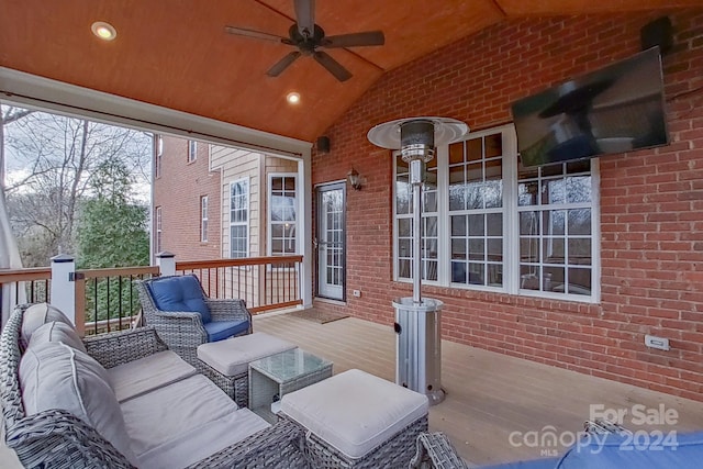 deck featuring outdoor lounge area and ceiling fan