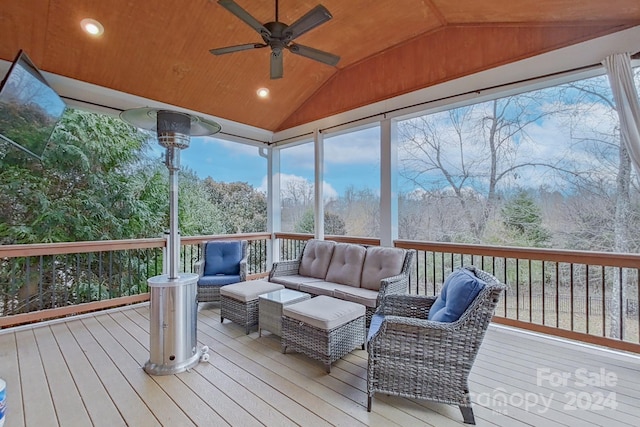 sunroom / solarium featuring wood ceiling, ceiling fan, lofted ceiling, and a wealth of natural light