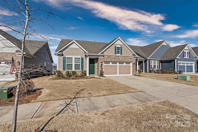 view of front of home with central AC, a front lawn, and a garage