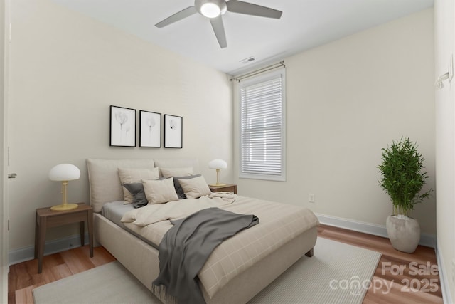 bedroom with hardwood / wood-style flooring and ceiling fan