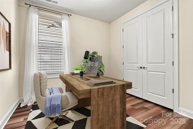 home office featuring dark wood-type flooring