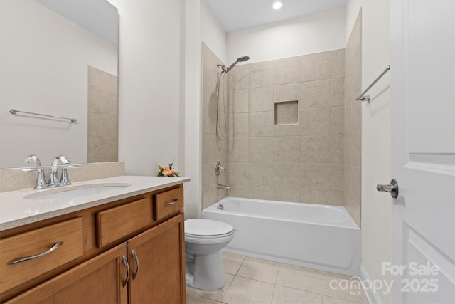 full bathroom featuring vanity, toilet, tile patterned floors, and tiled shower / bath