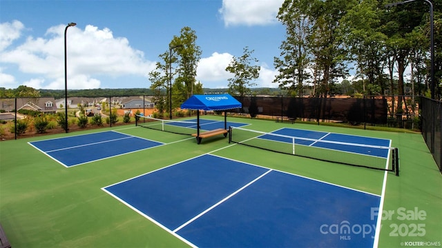 view of sport court featuring basketball hoop