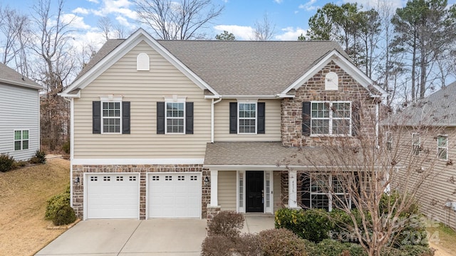 view of front of property with a garage