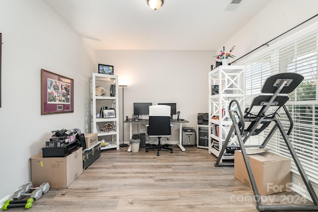 office with light wood-type flooring