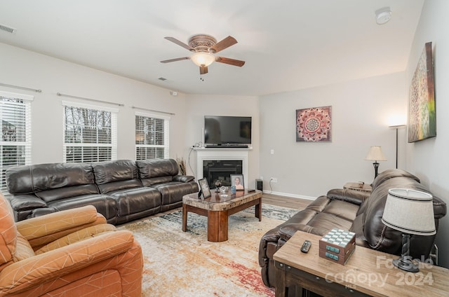 living room with hardwood / wood-style flooring and ceiling fan