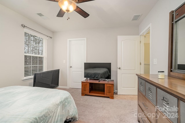 bedroom featuring ceiling fan and light carpet