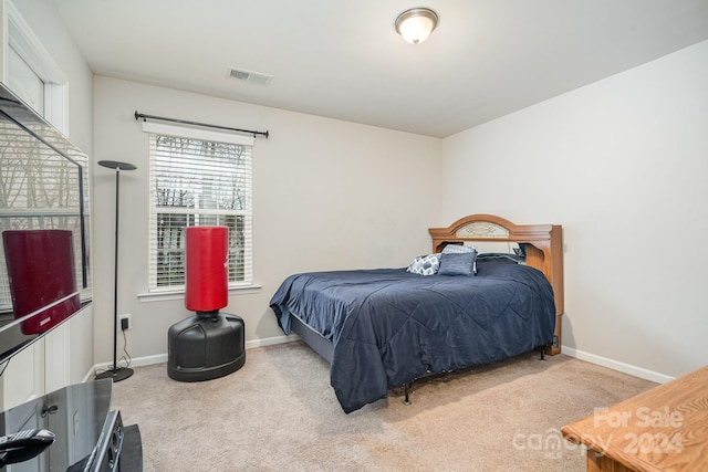 bedroom with light carpet