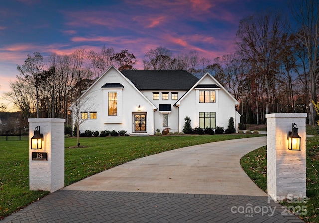 modern farmhouse with a yard