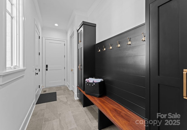 mudroom featuring crown molding