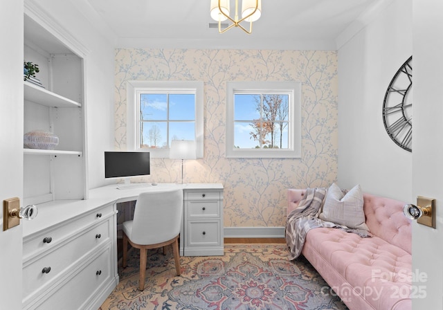 office area with an inviting chandelier and light wood-type flooring