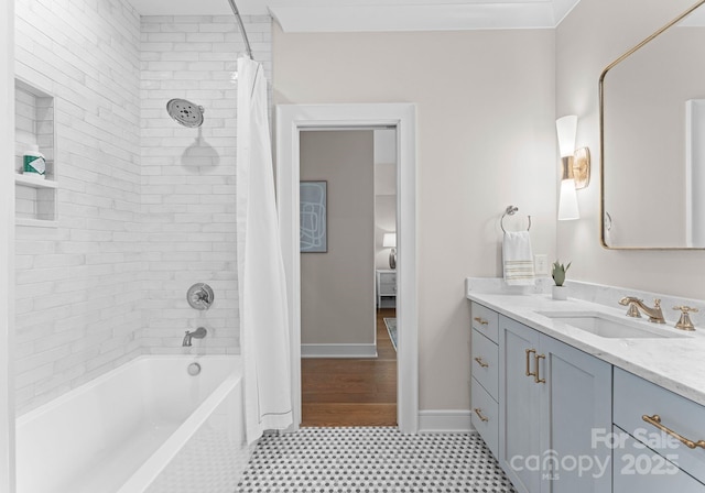 bathroom with shower / bath combo and vanity